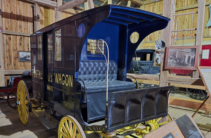 Image of a horse drawn U.S. Mail Wagon on display at the Farm Museum